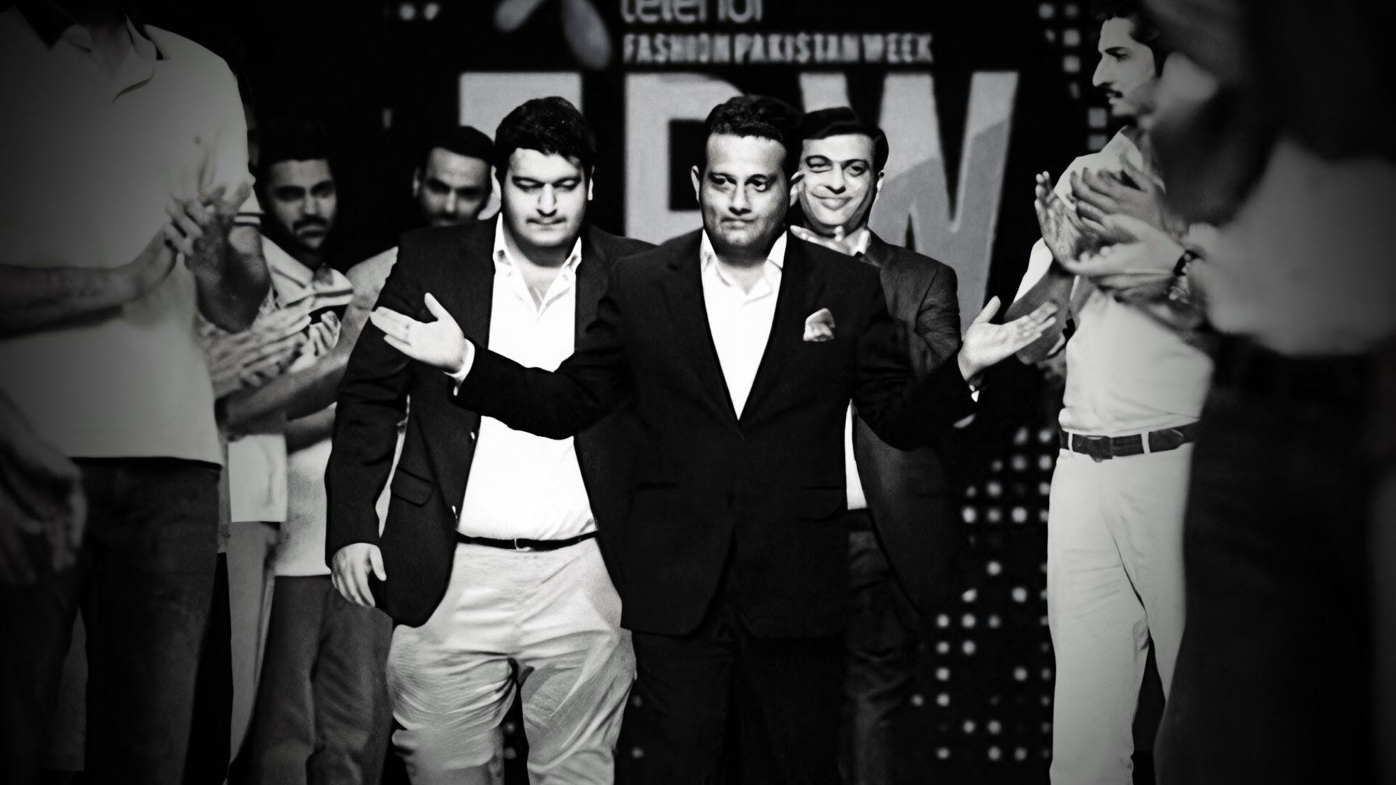 Sabih Toor walking the runway with his local brand team at Telenor Fashion Pakistan Week 2015
